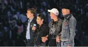  ??  ?? Gord Downie, Mike Downie, Pearl Wenjack and William Wenjack inspire 20,000 attendees at the inaugural WE Day Family in Toronto at the Air Canada Centre on October 19, 2016.