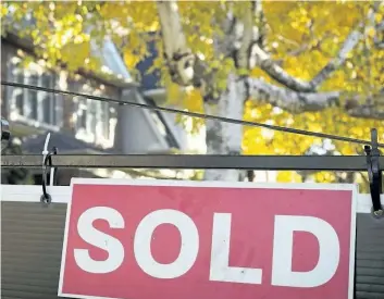  ?? THE CANADIAN PRESS FILES ?? Sales of existing homes across the Greater Toronto Area dropped 20.3 per cent last month from a year ago, after the government brought in regulation­s to cool the housing market.