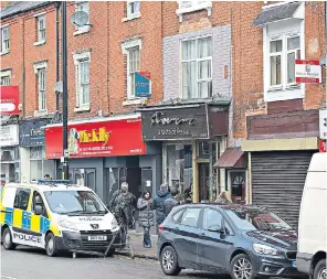  ??  ?? Main picture and left: Police raid Masood’s house in Birmingham Above: A flat above a restaurant in Birmingham which was also raided