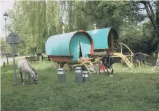  ??  ?? Two traditiona­l gypsy caravans at West Ayton earlier this summer.