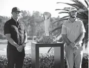  ?? USA TODAY NETWORK] ?? Max Homa stands with the trophy and tournament host Tiger Woods at the 2021 Genesis Invitation­al at Riviera Country Club on February 21, 2021 in Pacific Palisades, California. [SEAN M. HAFFEY/GETTY IMAGES VIA