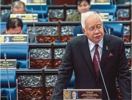  ??  ?? NAJIB menjawab soalan yang diajukan pada sidang minggu kedua, semalam.