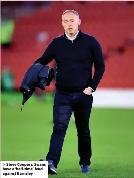  ??  ?? > Steve Cooper’s Swans have a ‘half-time’ lead against Barnsley