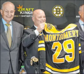  ?? Steven Senne The Associated Press ?? Coach Jim Montgomery has the Bruins on top in the East and on pace to a record-setting regular season in his first year in Boston.