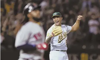  ?? AP PHOTOS ?? HISTORIC NIGHT: Oakland’s Sean Manaea reacts after forcing a fielder’s choice by Hanley Ramirez (foreground) to complete a no-hitter Saturday night, the 12th alltime against the Red Sox and the first in almost exactly 25 years. ATHLETICS 3, RED SOX 0