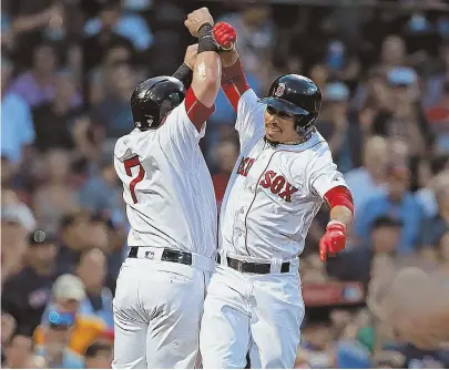  ?? STAFF PHOTO BY MATT STONE ?? HIGH TIMES: Mookie Betts celebrates his two-run homer with Christian Vazquez during the Red Sox’ win over the White Sox last night at Fenway.