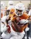  ??  ?? Texas’s Bijan Robinson (5) runs after a catch against UTEP during the first half of an NCAA college football game in Austin, Texas on
Sept 12. (AP)