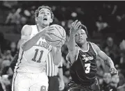  ?? [PHOTO BY BRYAN TERRY, THE OKLAHOMAN] ?? Oklahoma’s Trae Young goes to the basket past East Central’s Camron Talley during the Sooners 114-78 win over the Tigers in an exhibition game Wednesday night at Lloyd Noble Center.