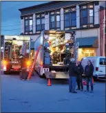  ?? Joseph B. Nadeau photo ?? The production crew of the AMC television horror series “NOS4A2” took over Market Square Thursday evening for a shoot in an old mill building behind the Museum of Work & Culture and River Falls Restaurant.