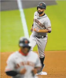  ?? Jack Dempsey / Associated Press ?? The Giants’ Brandon Belt rounds the bases after clubbing a threerun homer in the fourth inning of a victory.