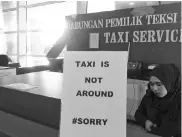  ??  ?? A notice at KIA Taxi Service Counter serves to inform the temporary absence of taxi services.