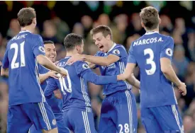  ?? — AP ?? Chelsea’s Eden Hazard (third from left) celebrates with team mates after scoring against Everton at Stamford Bridge in London on Saturday. The host won 5-0.