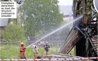  ?? ?? Firefighte­rs damp down as, inset, the structure continues to smoulder