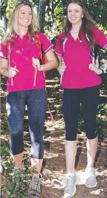  ??  ?? Tahnee Dickens and Chelsea Jocubeit enjoy a bushwalk on the Gold Coast. Picture: Tertius Pickard