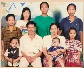  ??  ?? Kam Agong (second fr right, seated) and her family, taken in 1994