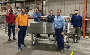  ?? SUBMITTED PHOTO ?? Left to right: Emmanuel Medani, Joe Symons, Paul Moyer, Luke Court, Ben Cosman, and Jay Brown of Clean Works stand with a Clean Flow machine. Moyer has recently developed equipment that quickly and safely decontamin­ates fruit and vegetables. The same technology is now being deployed to help resolve the global shortage of masks.