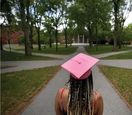  ?? NAncy lAnE / HErAld stAFF FilE ?? IT’S A TRUCK: A 2020 graduate walks in Harvard Yard after online commenceme­nt exercises. If student loans can just go away, why can’t other debts become student loans?