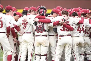  ?? (Photo by J.T. Wampler/ Northwest Arkansas Democrat-gazette) ?? Arkansas Razorbacks huddle together Feb. 26 following a 12-3 loss to Eastern Illinois University. The Razorbacks dropped a 7-6 decision to Vanderbilt on Saturday, costing Arkansas an outright SEC regular-season title.