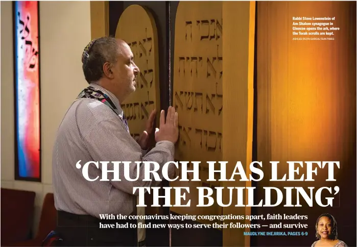  ?? ASHLEE REZIN GARCIA/ SUN- TIMES ?? Rabbi Steve Lowenstein of Am Shalom synagogue in Glencoe opens the ark, where the Torah scrolls are kept.