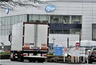  ?? /Bloomberg ?? Not for everyone: A haulage truck on an access road at the Pfizer facility in Puurs, Belgium, on Thursday. The quick approval of Pfizer’s vaccine in the UK is unlikely to accelerate the availabili­ty of the shot in Africa and other poorer areas of the world.