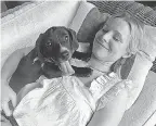  ?? PLANET PROVIDED BY DISCOVERY+/ ANIMAL ?? Rescue puppy Java curls up with Kristen Bell in a “Pup Close & Personal” segment during this year’s “Puppy Bowl XVII.”