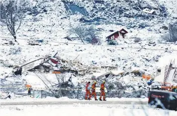  ?? TOR ERIK SCHROEDER AP ?? Rescue crews continue to search for landslide survivors Saturday in Ask, Norway. Seven people are missing.