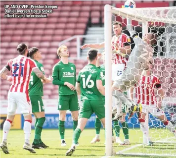  ??  ?? UP AND OVER: Preston keeper Daniel Iversen tips a Stoke effort over the crossbar.