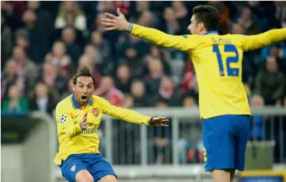  ?? AFP ?? Arsenal’s Santi Cazorla and Arsenal’s Olivier Giroud celebrate a goal against Bayern Munich. —