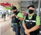  ?? Photo / Michael Cunningham ?? Whanga¯ rei CitySafe officers Adam Barclay and John Tucker keep an eye on Cameron St Mall at the start of alert level 2.