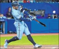  ?? The Associated Press ?? Jon Blacker
George Springer connects for a leadoff home run Saturday in the Blue Jays’ 2-1 win over Houston at Rogers Centre. The former Astros All-Star also went deep in the third inning.