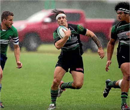  ??  ?? Palmerston North Old Boys Marist’s Luther Hirini finds a gap in his side’s day-one loss to eventual winners Napier OID Boys at the Spillane Cup.