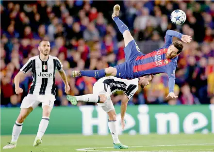  ?? —AP ?? Barcelona striker Lionel Messi loses balance as he attempts a header during the UEFA Champions League second leg quarterfin­al match against Juventus at Camp Nou. The match ended goalless but Juve advanced 3-0 on aggregate.