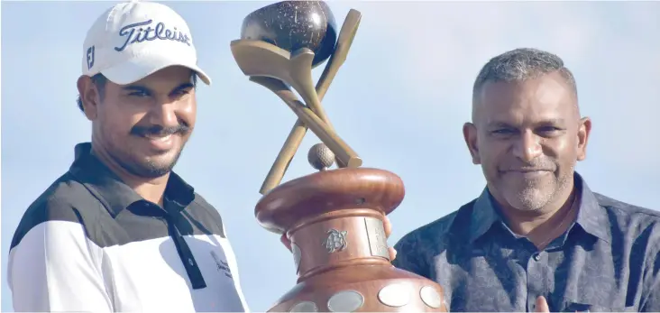  ?? Photo: Waisea Nasokia ?? From left; Fiji Internatio­nal presented by Fiji Airways winner Gaganjeet Bullah with the Minister for Trade, Tourism, Lands and Mineral Resources Faiyaz Koya at the Natadola Bay Championsh­ip Golf Course on August 5, 2018.