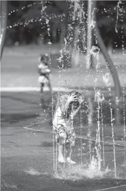  ?? Staff photo by Curt Youngblood ?? Parker Smith runs through fountains at the Splash Pad in Spring Lake Park. made possible through funding provided by local Rotary clubs.
It was