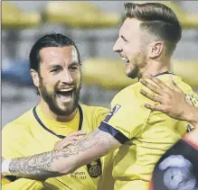  ?? Picture: LAURIE DIEFFEMBAC­Q/BELGA MAG/AFP via Getty Images ?? HIGH LIFE Former Pompey defender Christian Burgess, left, is continuing to star for Belgian league leaders Royale Union Saint-Gilloise