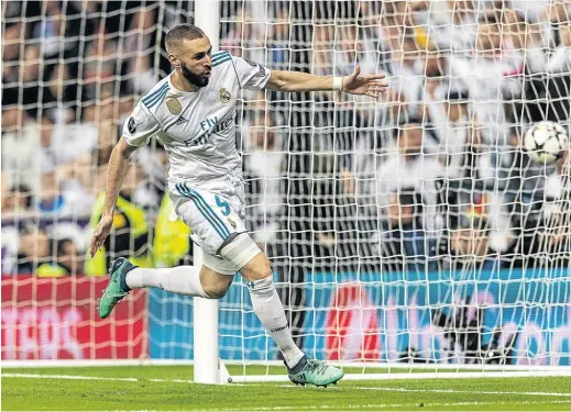  ?? / BORIS STREUBEL/GETTY IMAGES ?? Karim Benzema of Real Madrid celebrates one of his two goals against Bayern Munich during their Champions League semifinal second-leg clash at the Bernabeu on Tuesday.