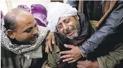  ?? HASSAN AMMAR/ASSOCIATED PRESS ARCHIVE ?? A man is comforted by others as he mourns over Egyptian Coptic Christians who were captured in Libya and killed by militants in 2016.