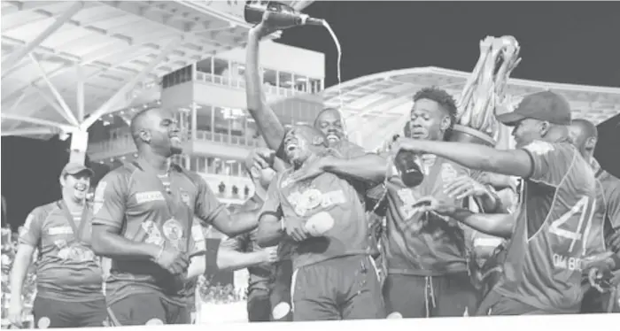  ??  ?? Trinbago Knight Riders celebrate their capture of the 2017 Caribbean Premier League title on Saturday.