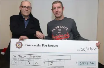  ??  ?? Enniscorth­y Fire Services cheque presentati­on of €3875 to Tilly Brennan family, proceeds of their