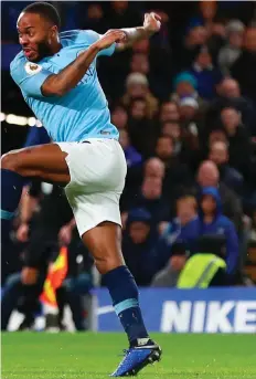  ??  ?? Raheem Sterling gets a shot on goal despite the close attention of Marcos Alonso. Inset, opposite page: A screen-shot of the moment when several Chelsea fans hurled verbal abuse at the Manchester City man as he prepared to get a ball for a throw-in