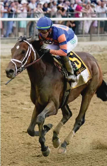  ?? AP ?? Mo Donegal, with jockey Irad Ortiz Jr., crosses the finish line to win the 154th running of the Belmont Stakes.