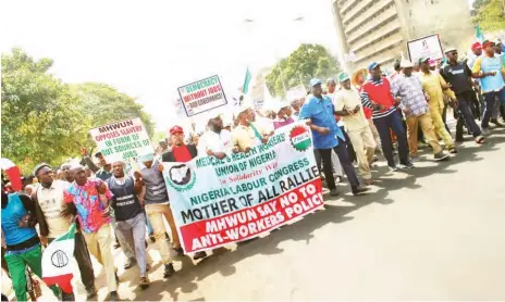  ?? PHOTO: ?? Nigeria Labour Congress officials with members of the Nigerian Union of Teachers and MHWUN during a protest over the sack of workers by the Kaduna State Government Shehu K. Goro