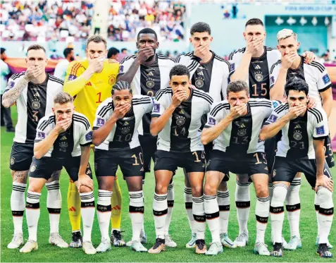  ?? ?? The German players covered their mouths in the team photograph before their opening World Cup game in protest against Fifa’s ban on the One Love LGBT symbol