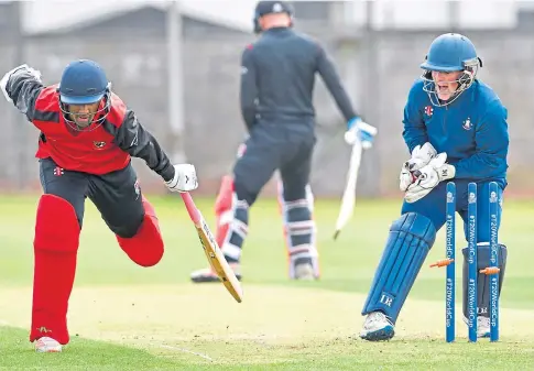  ?? ?? ELECTRIC START: Forfarshir­e wicket-keeper Callum Garden removes the bails in a runout attempt on Tandel Neel.