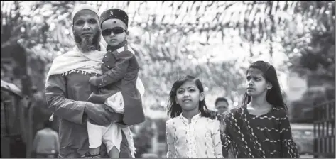  ?? ANUPAM NATH/AP ?? A Muslim family comes to offer Eid al-Fitr prayers in Gauhati, India on Tuesday.