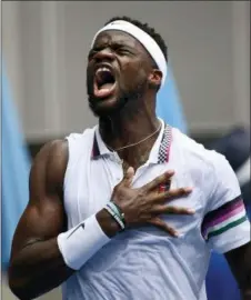  ?? ANDY BROWNBILL — THE ASSOCIATED PRESS ?? United States’ Frances Tiafoe celebrates after defeating Kevin Anderson in their second-round match at the Australian Open in Melbourne, Australia on Wednesday.