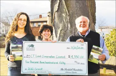  ?? Contribute­d photo ?? From left are Amanda Kenyon, Rockfall Foundation grants and communicat­ions coordinato­r; Amy Blaymore Paterson, Connecticu­t Land Conservati­on Council executive director; and Tony Marino, Rockfall Foundation executive director. They show off a $4,350 donation check.