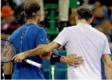  ?? PHOTO: REUTERS ?? Long-time rivals Rafael Nadal, left, and Roger Federer embrace at the net after their 38th match.