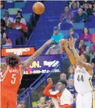  ?? GERALD HERBERT/ASSOCIATED PRESS ?? Solomon Hill (44) of the New Orleans Pelicans shoots over Houston’s Montrezl Harrell during Friday’s game.