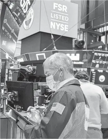  ?? COURTNEY CROW AP ?? Stocks rallied in the wake of election results. Analysts attributed the movement to a favorable scenario where a Republican Senate dilutes the power of a Democratic president, limiting his ability to enact tax increases or antitrust regulation against big tech companies. As of the morning of Nov. 6 (when this question was sent to the Econometer panel), vote totals were not yet completed, but it didn’t stop the market from reacting. Still, there were other concerns for the economy addressed as the likelihood of a Biden victory seemed more possible, as well as the Democrats controllin­g the House and Republican­s the Senate. One of them was concerned a second COVID stimulus would not happen until Biden officially takes office.